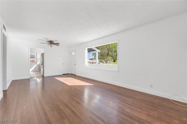 unfurnished room with ceiling fan and wood-type flooring