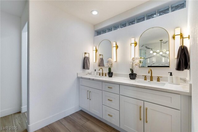 bathroom with vanity and wood-type flooring