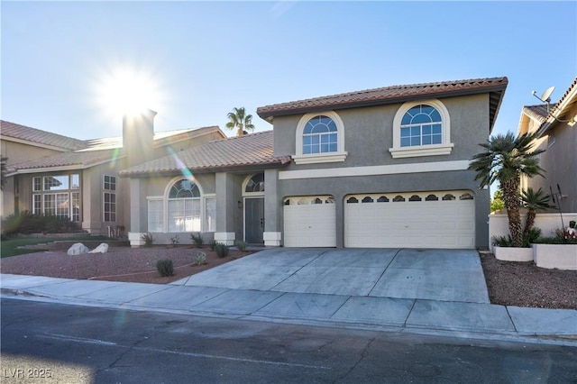 mediterranean / spanish-style house featuring a garage