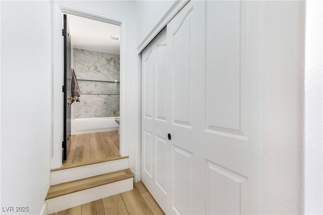 staircase with wood-type flooring