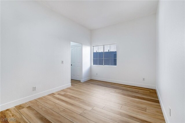 spare room with light hardwood / wood-style flooring