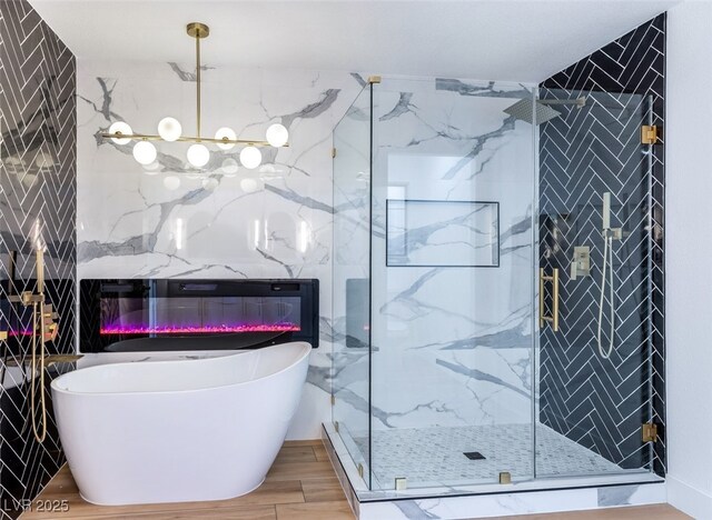 bathroom featuring shower with separate bathtub and hardwood / wood-style flooring