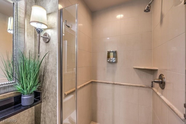 bathroom with tiled shower