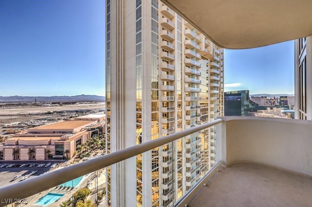 balcony featuring a mountain view