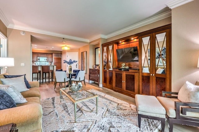 living room featuring light wood-type flooring and crown molding