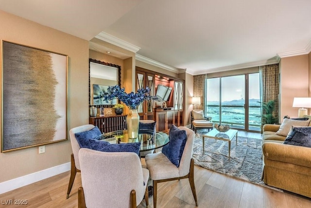 dining area with crown molding and hardwood / wood-style floors