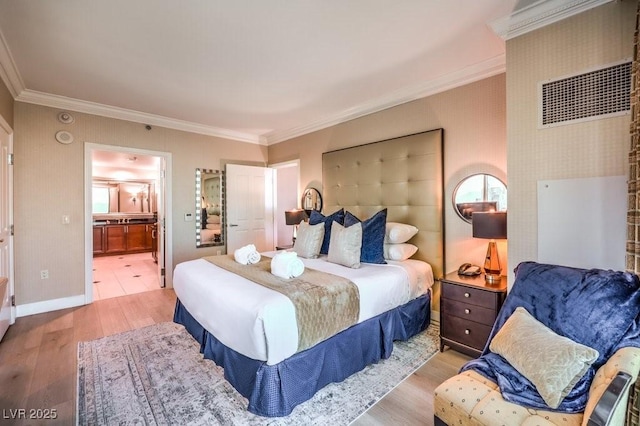 bedroom with ornamental molding, light hardwood / wood-style floors, and connected bathroom