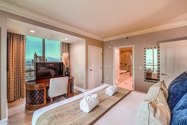 bedroom featuring crown molding, connected bathroom, and light hardwood / wood-style flooring