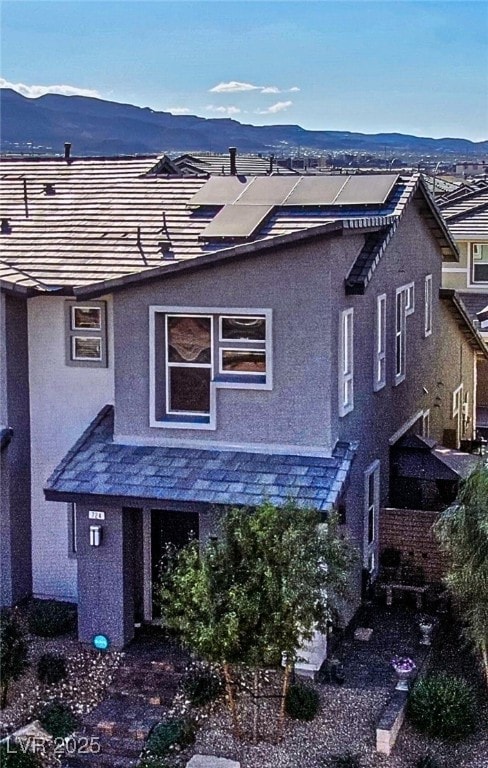 back of house featuring a mountain view