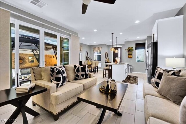 living room featuring ceiling fan