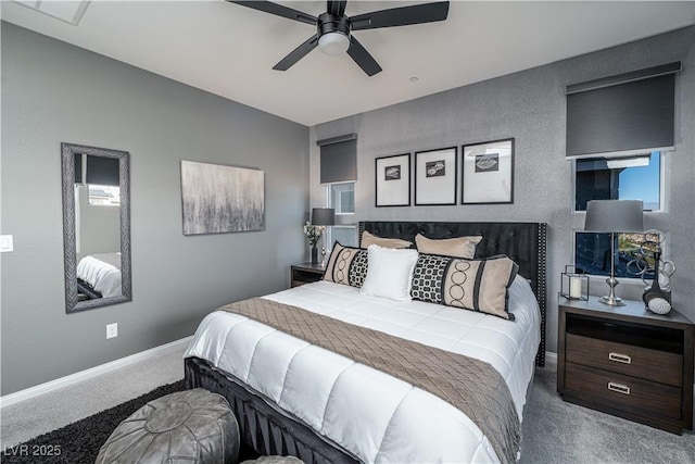 bedroom featuring ceiling fan and carpet