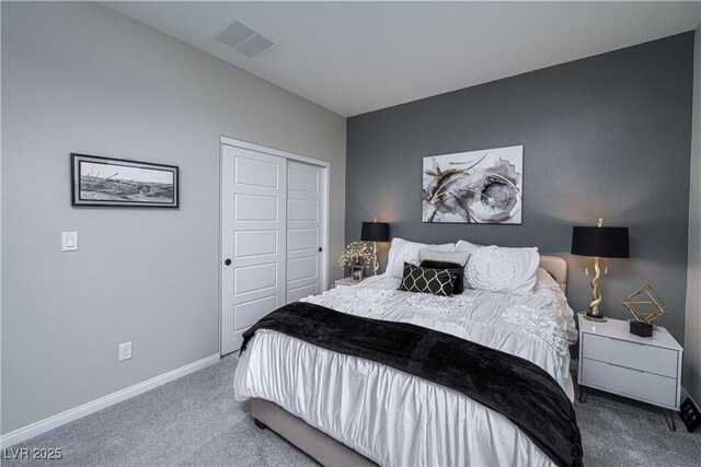 bedroom featuring a closet and carpet flooring