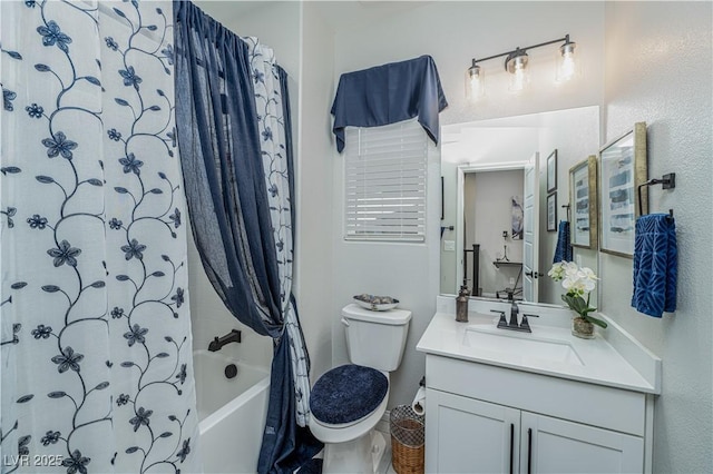 full bathroom featuring toilet, vanity, and shower / bathtub combination with curtain