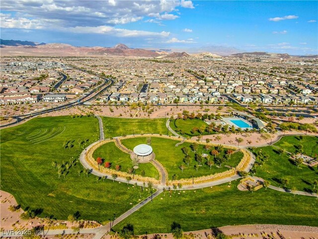 birds eye view of property featuring a mountain view