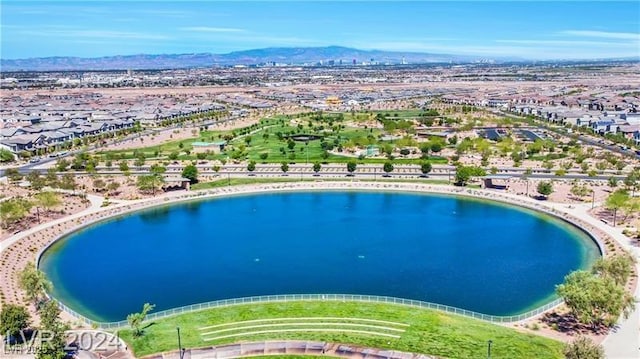 aerial view featuring a water and mountain view