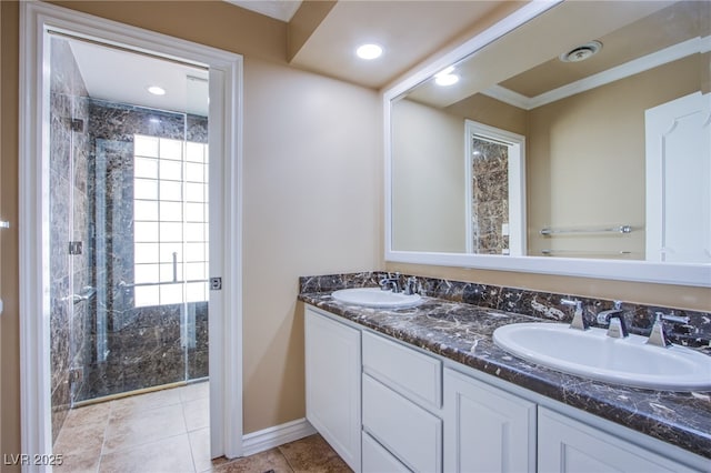 bathroom with a shower with shower door, vanity, and a wealth of natural light