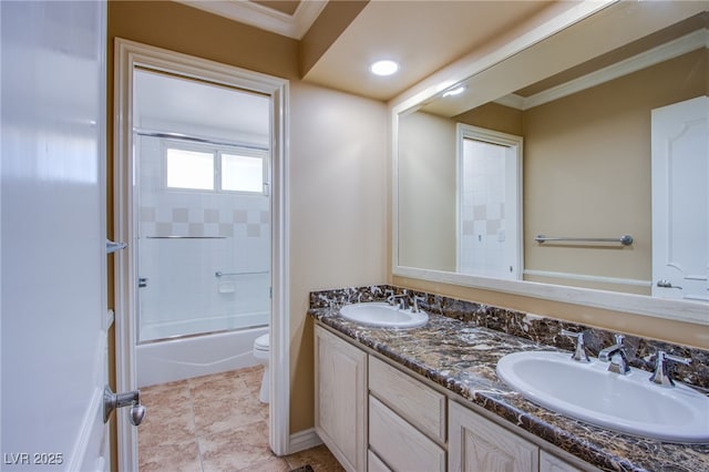 full bathroom with toilet, crown molding, vanity, and shower / bath combination with glass door