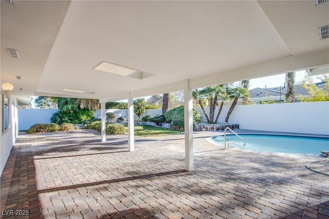 view of swimming pool with a patio area