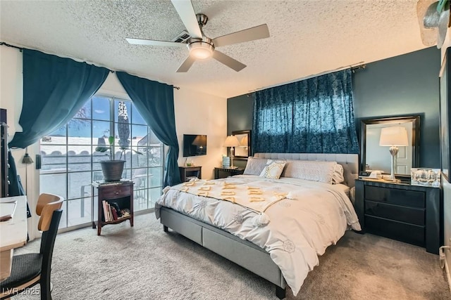 bedroom with ceiling fan, a textured ceiling, and carpet floors