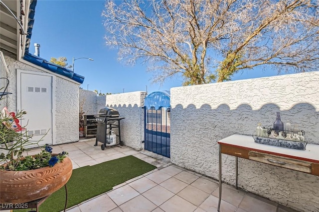 view of patio with a grill