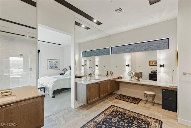 ensuite bathroom with vanity, visible vents, and ensuite bathroom