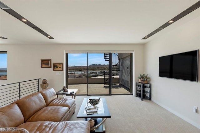 carpeted living room featuring plenty of natural light