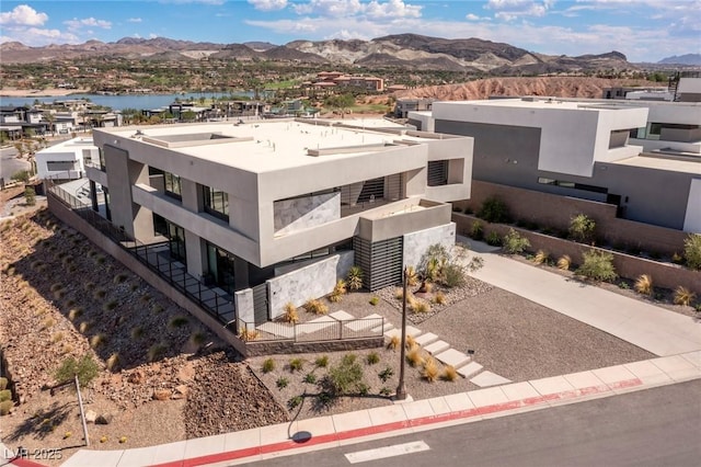 birds eye view of property featuring a mountain view