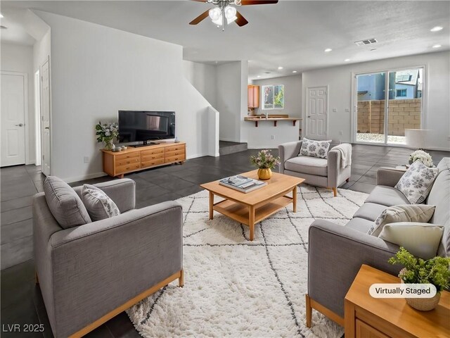 living room with ceiling fan