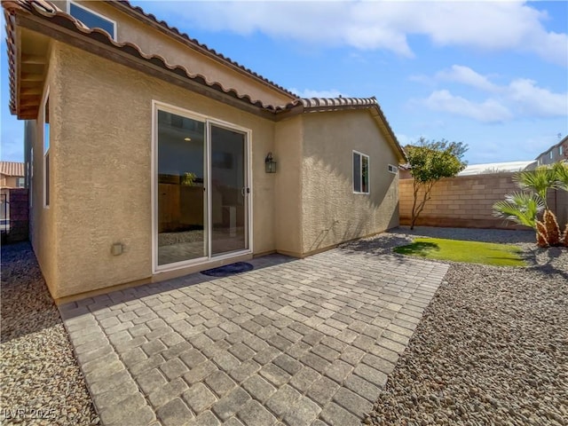 back of property with a patio