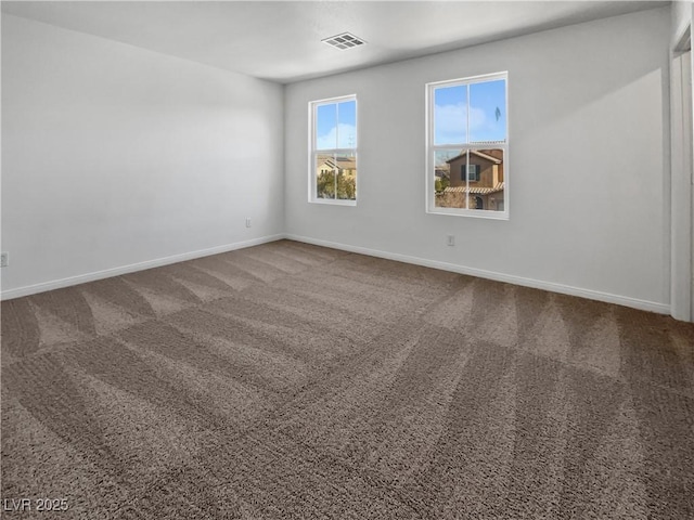 spare room featuring carpet floors