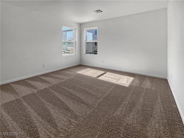 unfurnished room featuring carpet