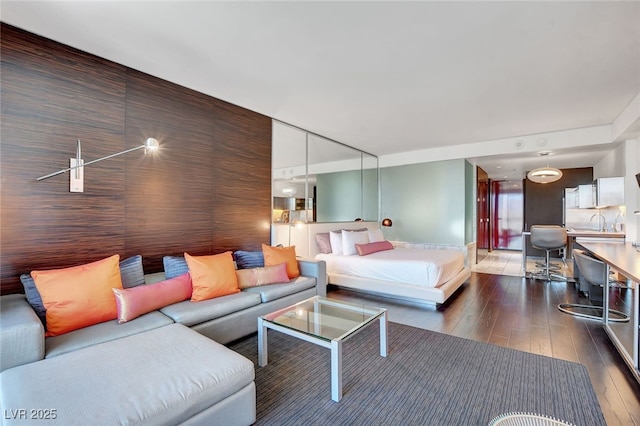 bedroom featuring sink and dark hardwood / wood-style floors