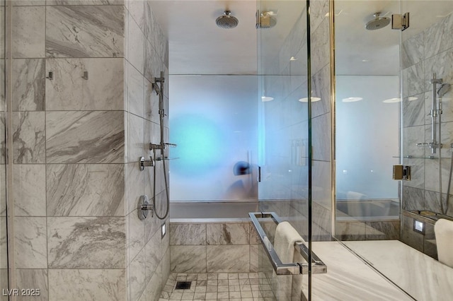 bathroom featuring a shower with shower door