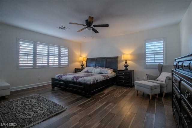 bedroom with ceiling fan and dark hardwood / wood-style floors