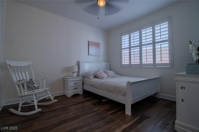 bedroom with ceiling fan and dark hardwood / wood-style floors