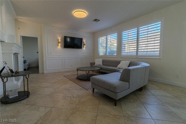 tiled living room featuring a fireplace