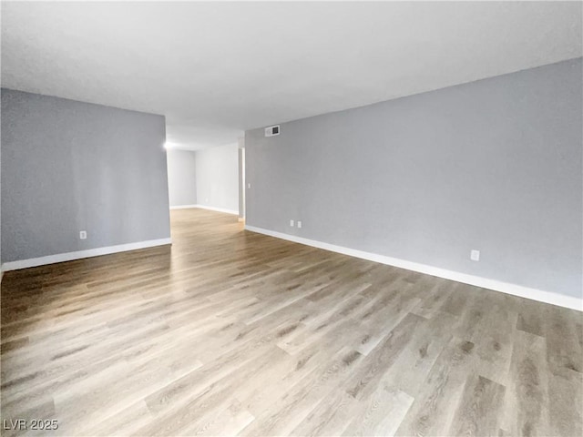 spare room with light hardwood / wood-style flooring