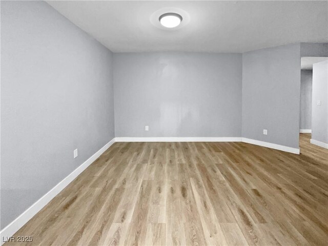 unfurnished room with light hardwood / wood-style flooring