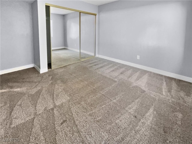 unfurnished bedroom with carpet and a closet