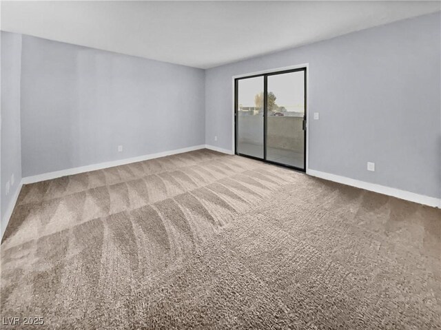 unfurnished room with carpet flooring