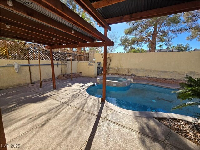 view of pool featuring an in ground hot tub and a patio area