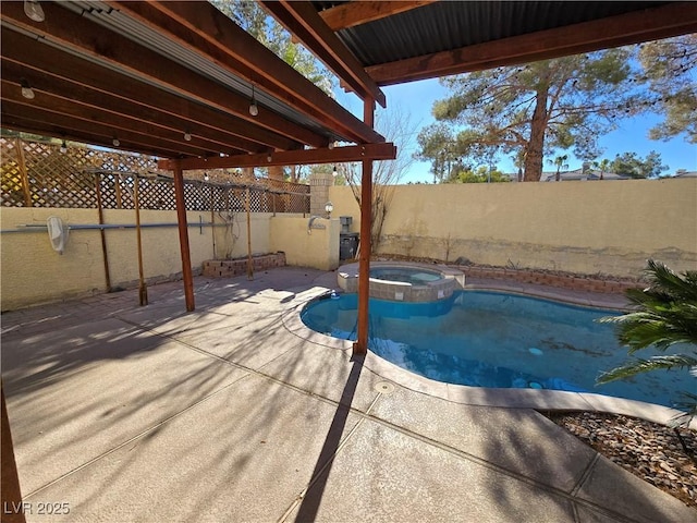 view of pool with an in ground hot tub and a patio area