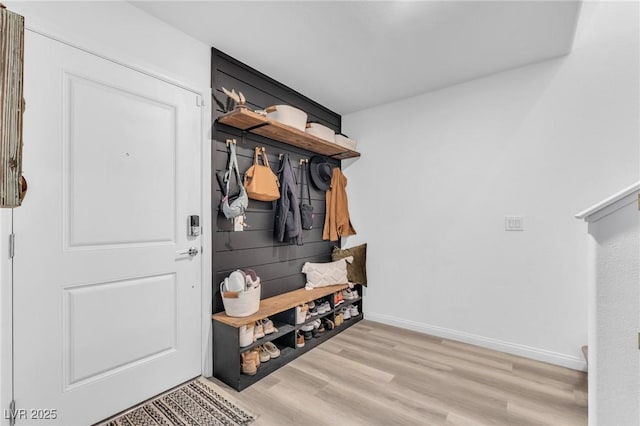 mudroom with light hardwood / wood-style floors