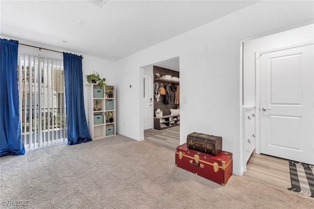 interior space featuring light colored carpet