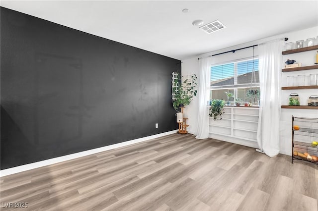 empty room featuring light hardwood / wood-style floors