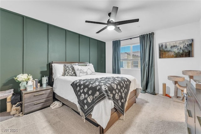 bedroom with light carpet and ceiling fan