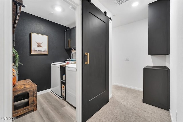 kitchen featuring washer and clothes dryer and a barn door