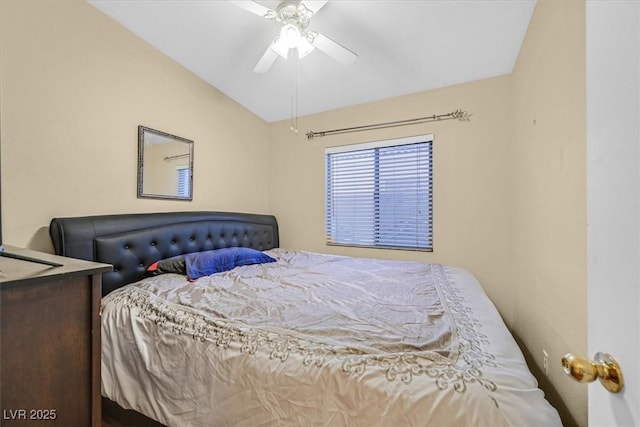 bedroom with ceiling fan and vaulted ceiling