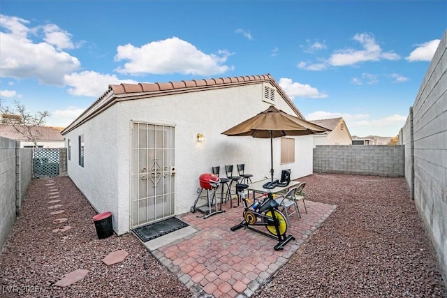 back of property with a patio area