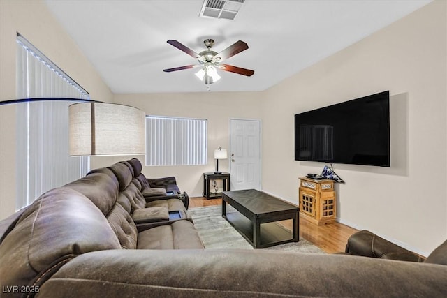 living room with ceiling fan and light hardwood / wood-style flooring